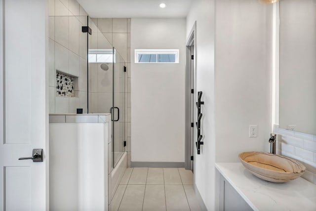 127 Cypress Shores Ln, Kingsland, TX 78639 - full bath featuring tile patterned floors, vanity, shower / bath combination with glass door, and recessed lighting