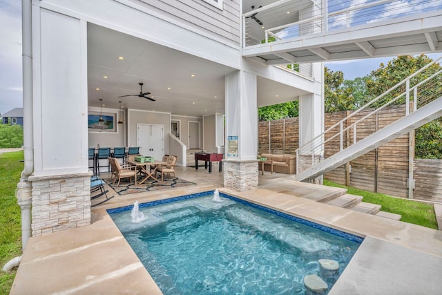 127 Cypress Shores Ln, Kingsland, TX 78639 - view of swimming pool with ceiling fan, outdoor dining area, and a patio area
