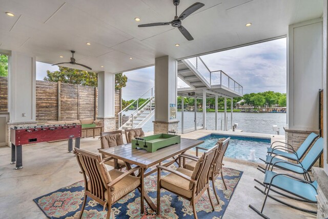 127 Cypress Shores Ln, Kingsland, TX 78639 - view of patio featuring ceiling fan, stairway, an outdoor pool, and a water view