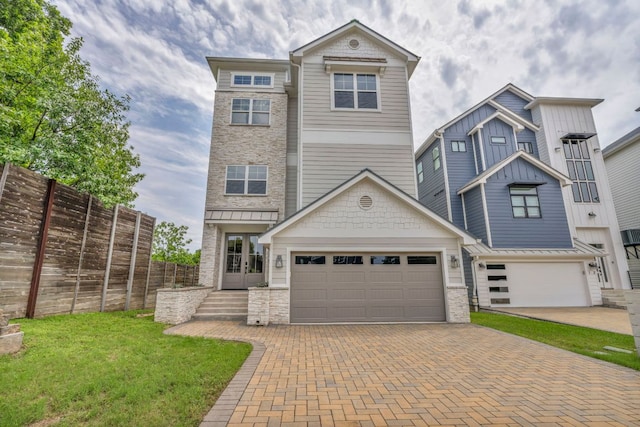 127 Cypress Shores Ln, Kingsland, TX 78639 - view of front of house with a garage, french doors, decorative driveway, and stone siding