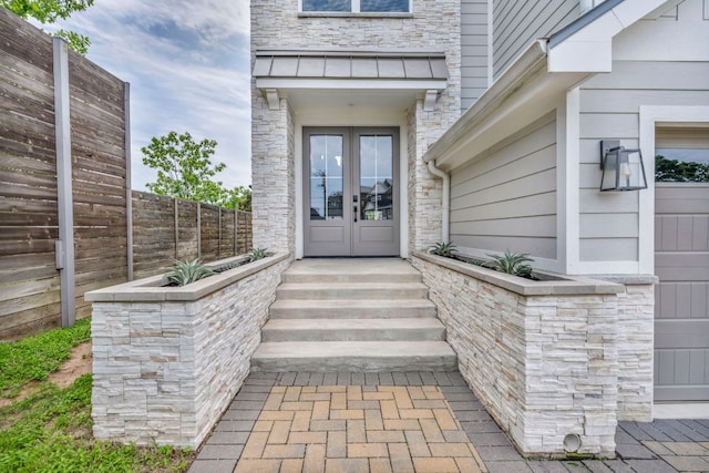 127 Cypress Shores Ln, Kingsland, TX 78639 - view of exterior entry featuring french doors and stone siding