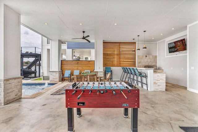 127 Cypress Shores Ln, Kingsland, TX 78639 - rec room with concrete floors and a ceiling fan