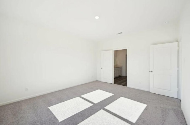 1504 Morris Loop, San Marcos, TX 78666 - unfurnished bedroom with carpet flooring, baseboards, and recessed lighting