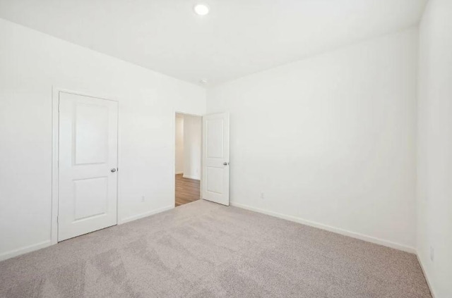 1504 Morris Loop, San Marcos, TX 78666 - unfurnished bedroom featuring carpet floors, baseboards, and recessed lighting