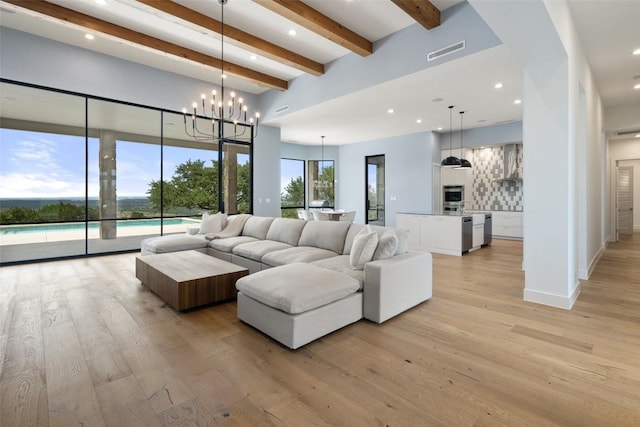 7816 Lynchburg Dr, Austin, TX 78738 - living area with beam ceiling, light wood-style flooring, recessed lighting, a chandelier, and a towering ceiling