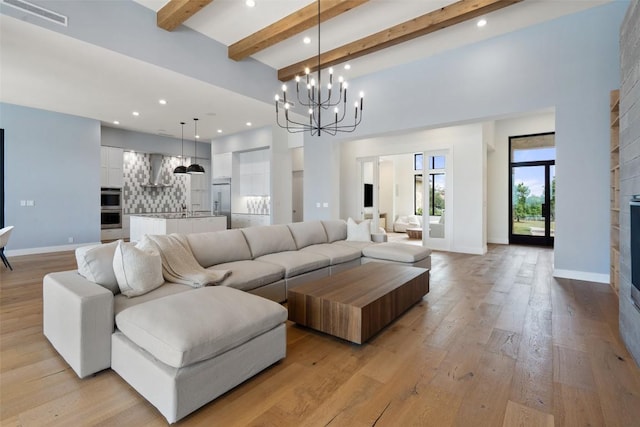 7816 Lynchburg Dr, Austin, TX 78738 - living area with a chandelier, beam ceiling, recessed lighting, light wood-style floors, and baseboards