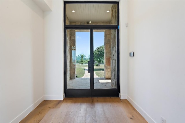 7816 Lynchburg Dr, Austin, TX 78738 - doorway to outside featuring plenty of natural light, baseboards, wood finished floors, recessed lighting, and french doors