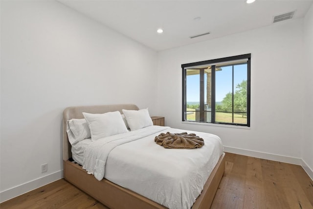 7816 Lynchburg Dr, Austin, TX 78738 - bedroom featuring baseboards, recessed lighting, and wood finished floors