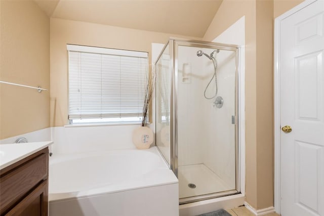 9305 Pioneer Forest Dr, Austin, TX 78744 - full bathroom with a stall shower, a garden tub, and vanity