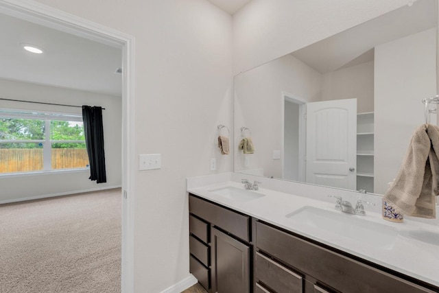 2900 Tweedy Trl, Pflugerville, TX 78660 - bathroom with double vanity, baseboards, and recessed lighting