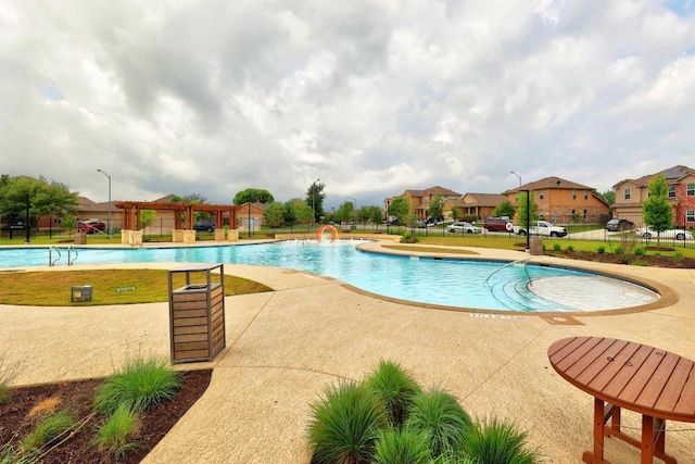 2900 Tweedy Trl, Pflugerville, TX 78660 - community pool with a patio area and a residential view