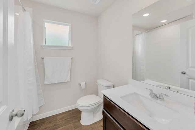2900 Tweedy Trl, Pflugerville, TX 78660 - bathroom with toilet, vanity, wood finished floors, baseboards, and recessed lighting