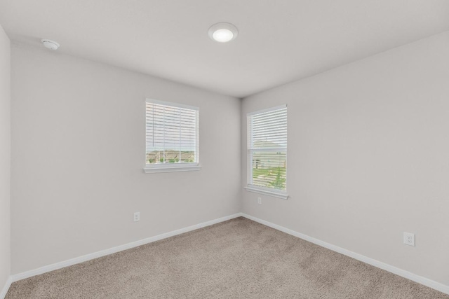 2900 Tweedy Trl, Pflugerville, TX 78660 - carpeted spare room featuring a smoke detector and baseboards
