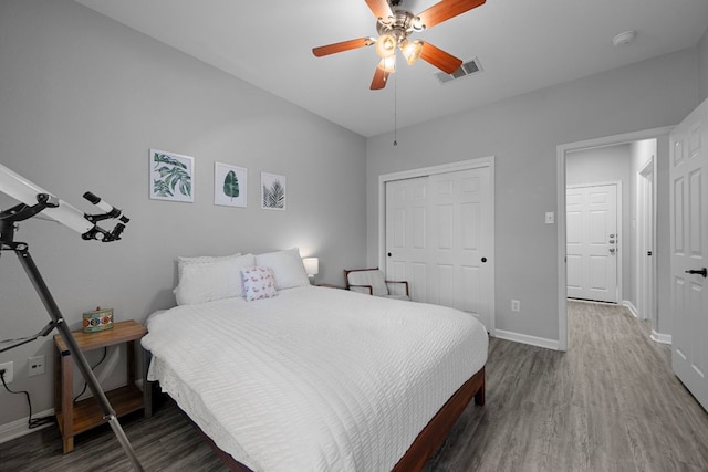2208 Barnett Dr, Cedar Park, TX 78613 - bedroom featuring wood finished floors, baseboards, a closet, and ceiling fan