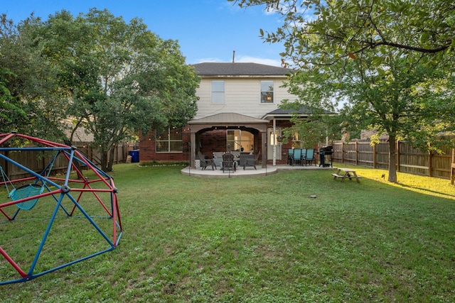 2208 Barnett Dr, Cedar Park, TX 78613 - back of house featuring a gazebo, a patio area, and brick siding