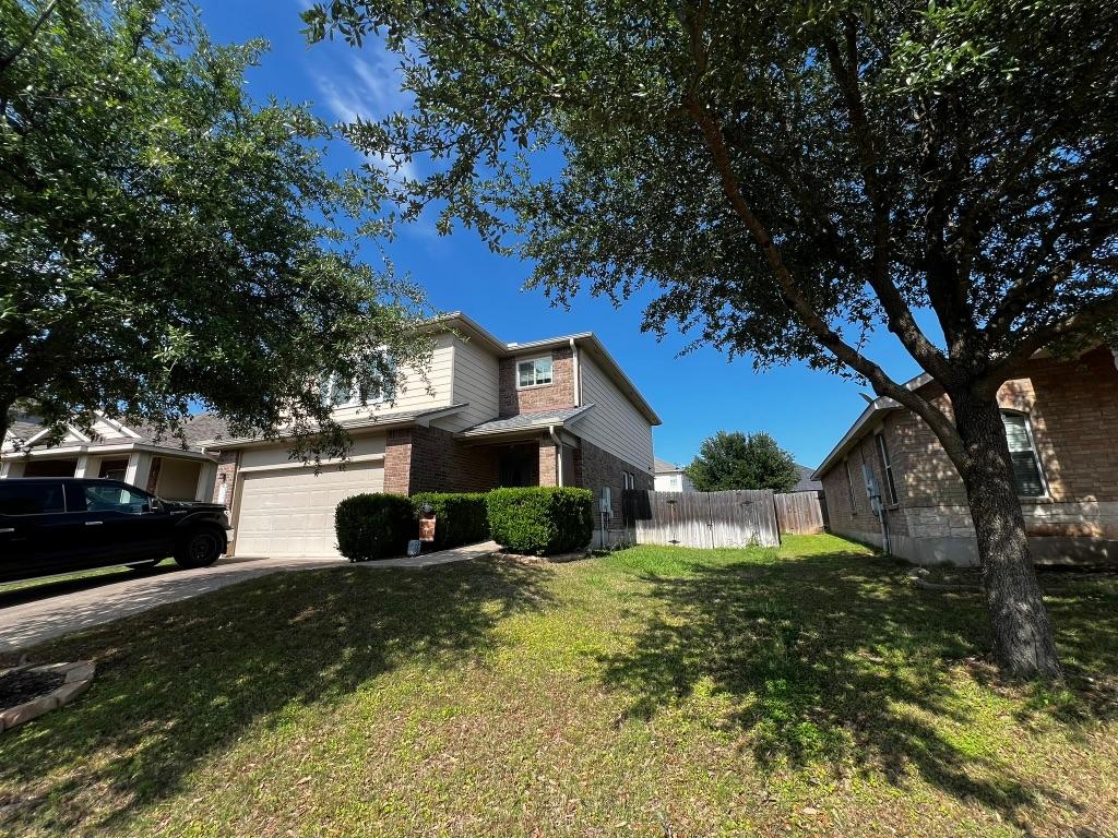 304 Kingfisher Ln, Leander, TX 78641 - view of front of property featuring brick siding and driveway
