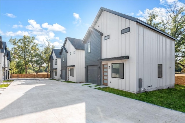 3001 E 51st St Unit 4, Austin, TX 78723 - back of property with board and batten siding and driveway