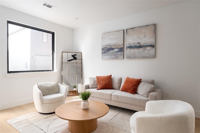 3001 E 51st St Unit 4, Austin, TX 78723 - living area featuring baseboards and wood finished floors