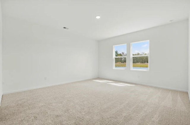 129 Bridgeview Dr, Hutto, TX 78634 - carpeted spare room featuring baseboards and recessed lighting