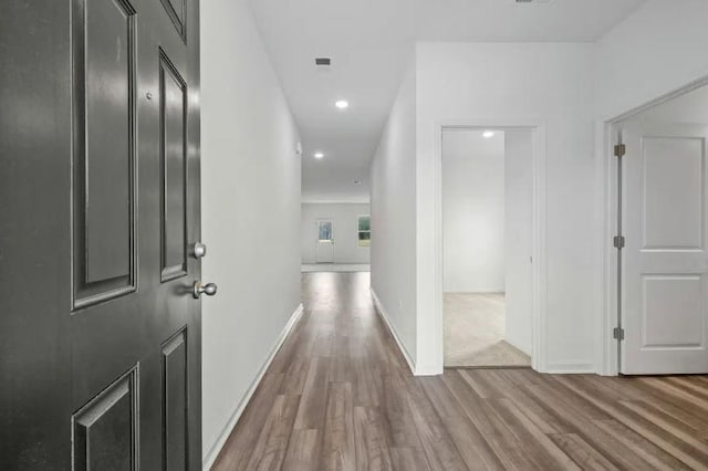129 Bridgeview Dr, Hutto, TX 78634 - corridor featuring wood finished floors, recessed lighting, and baseboards
