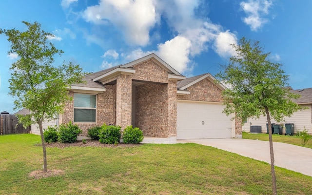 1678 Woodlands Dr, Kyle, TX 78640 - view of front of house with brick siding, an attached garage, and concrete driveway