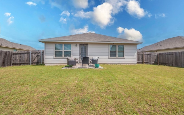 1678 Woodlands Dr, Kyle, TX 78640 - back of property featuring a fenced backyard and a patio area