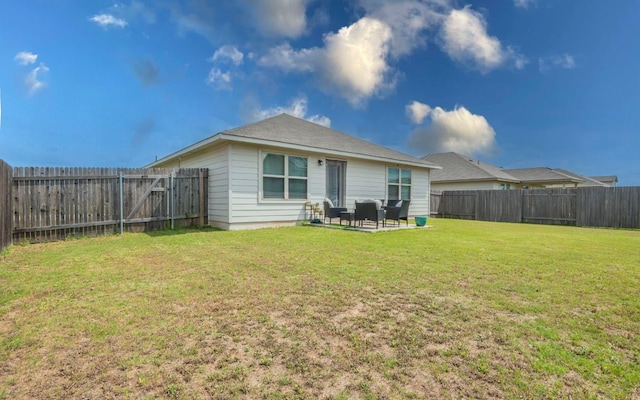 1678 Woodlands Dr, Kyle, TX 78640 - back of property with a fenced backyard and a patio