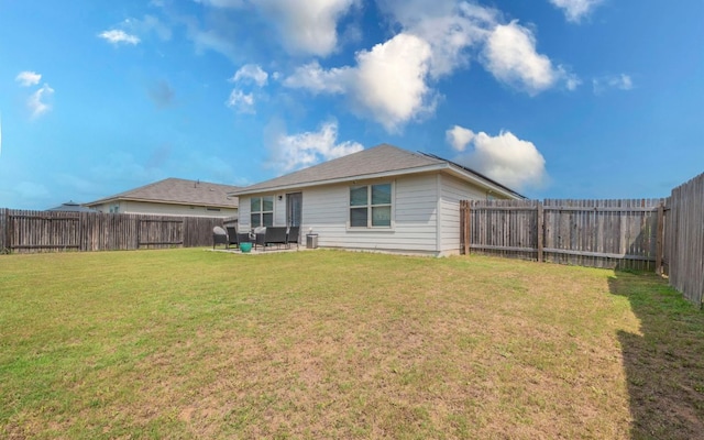 1678 Woodlands Dr, Kyle, TX 78640 - back of house with a fenced backyard