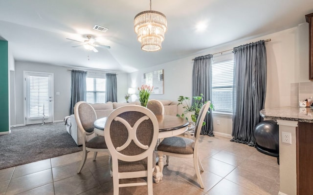 1678 Woodlands Dr, Kyle, TX 78640 - dining space featuring a ceiling fan, light tile patterned flooring, and a chandelier