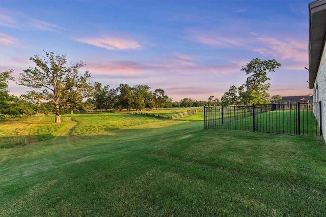 view of yard with a rural view