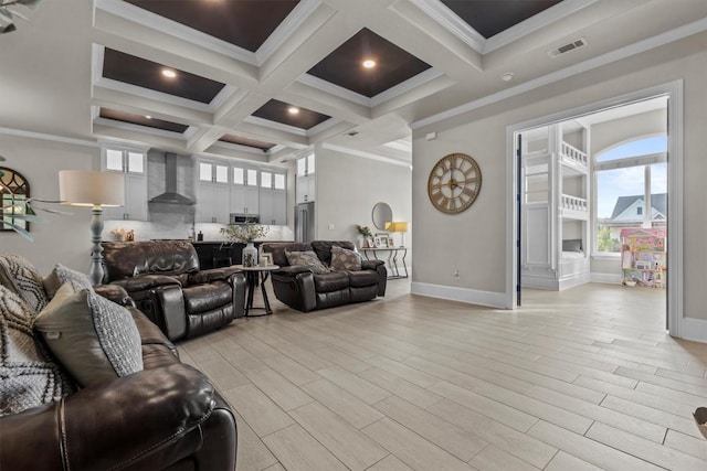 living room with beam ceiling, coffered ceiling, baseboards, light wood-style flooring, and crown molding