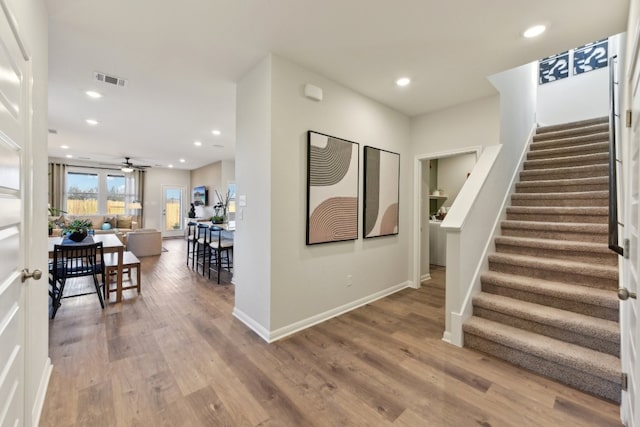 209 Escape Way, Jarrell, TX 76537 - foyer entrance featuring stairs, wood finished floors, a ceiling fan, recessed lighting, and baseboards