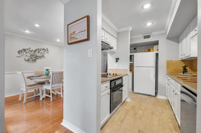 4159 Steck Ave Unit 162, Austin, TX 78759 - kitchen featuring black appliances, crown molding, under cabinet range hood, white cabinets, and recessed lighting