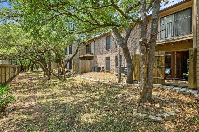 4159 Steck Ave Unit 162, Austin, TX 78759 - rear view of property with central AC and brick siding