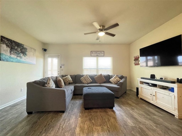 19900 Hubert R Humphrey Rd, Manor, TX 78653 - living area featuring dark wood finished floors, plenty of natural light, a ceiling fan, and baseboards