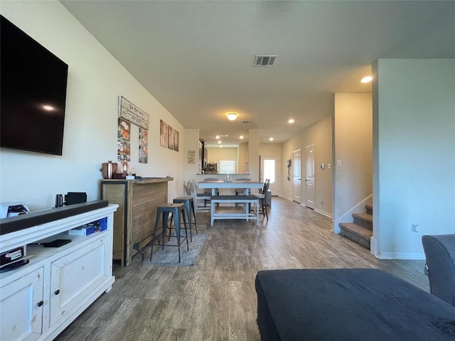 19900 Hubert R Humphrey Rd, Manor, TX 78653 - living area with dark wood-style floors, stairway, recessed lighting, and baseboards
