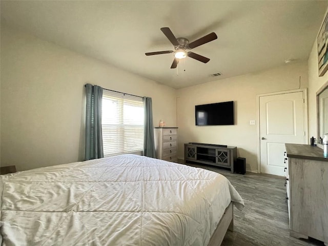 19900 Hubert R Humphrey Rd, Manor, TX 78653 - bedroom featuring dark wood-style floors, a ceiling fan, and baseboards