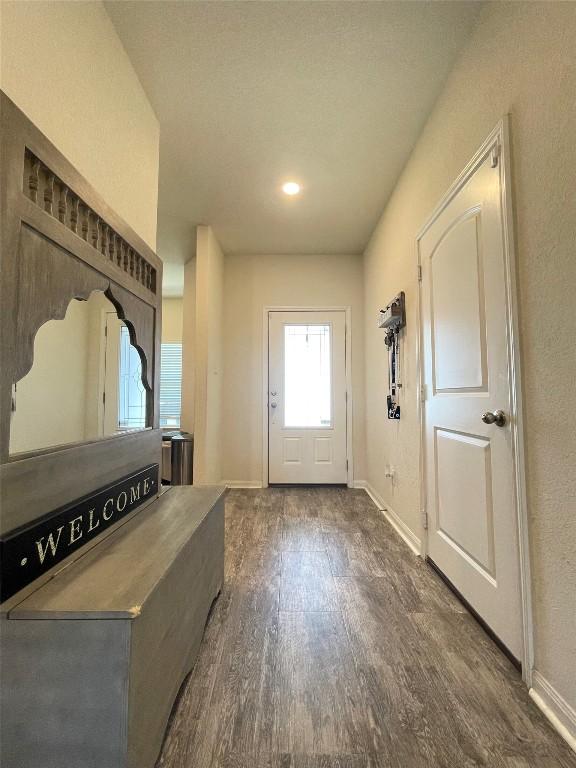 19900 Hubert R Humphrey Rd, Manor, TX 78653 - foyer entrance featuring baseboards and dark wood finished floors
