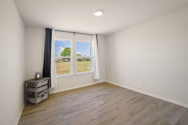 109 Egret Dr, Bastrop, TX 78602 - empty room with wood finished floors and baseboards