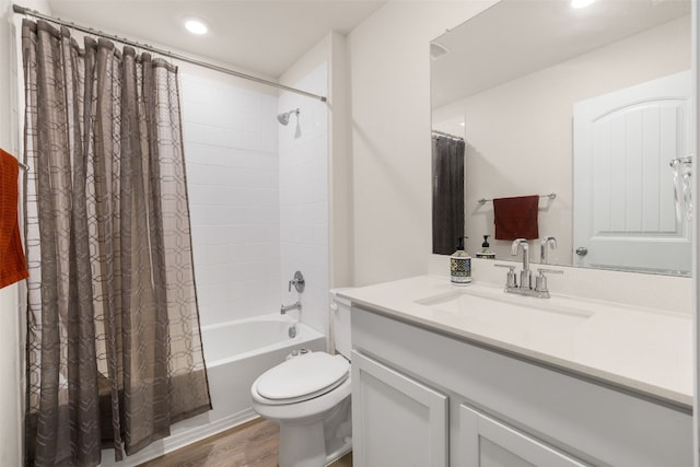 109 Egret Dr, Bastrop, TX 78602 - bathroom featuring vanity, toilet, shower / bath combination with curtain, wood finished floors, and recessed lighting