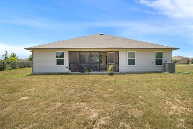 109 Egret Dr, Bastrop, TX 78602 - rear view of property with a sunroom and central air condition unit