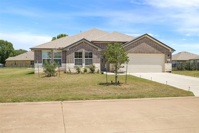 109 Egret Dr, Bastrop, TX 78602 - view of front of house with brick siding, a garage, concrete driveway, and a shingled roof