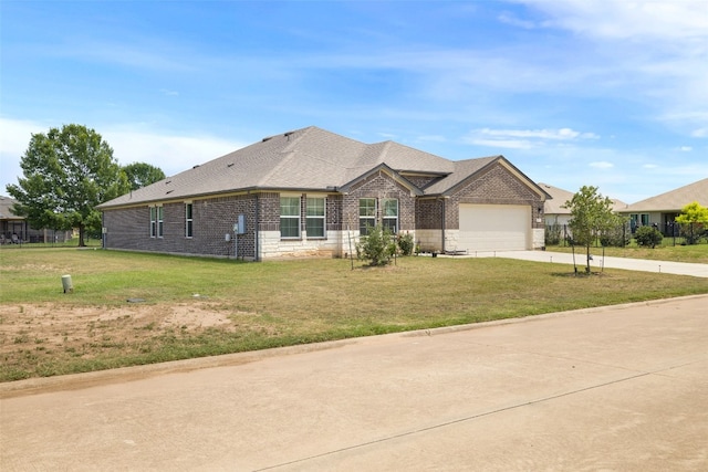 109 Egret Dr, Bastrop, TX 78602 - view of front of property with concrete driveway, a garage, a front lawn, and brick siding