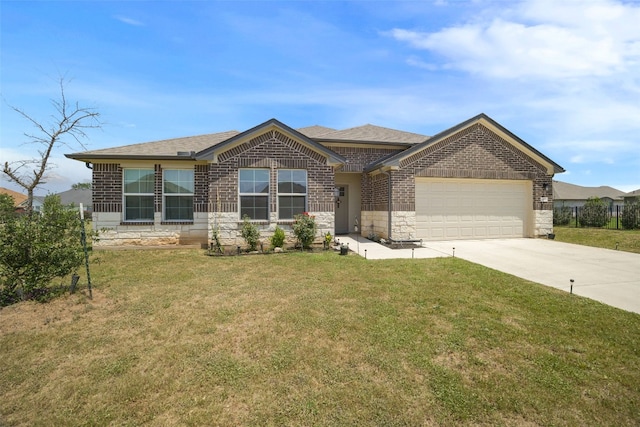 109 Egret Dr, Bastrop, TX 78602 - view of front of property featuring a garage, concrete driveway, a front lawn, and brick siding