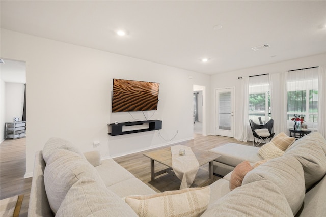 109 Egret Dr, Bastrop, TX 78602 - living area with light wood-type flooring, recessed lighting, and baseboards