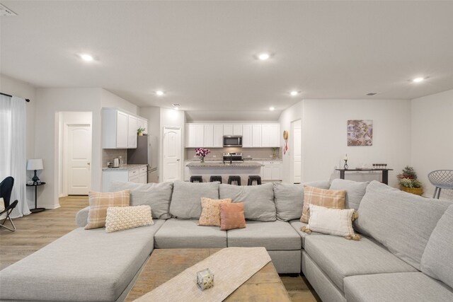 109 Egret Dr, Bastrop, TX 78602 - living room featuring recessed lighting, light wood-style floors, and baseboards