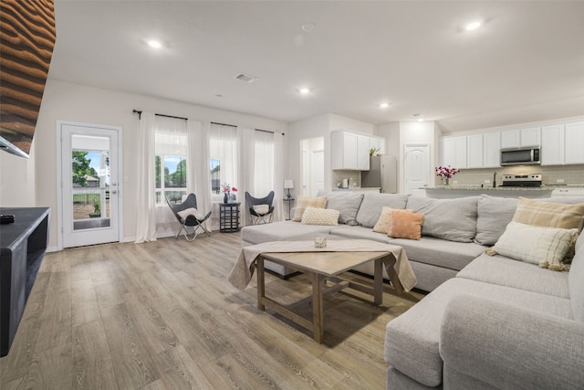 109 Egret Dr, Bastrop, TX 78602 - living area with light wood-type flooring and recessed lighting