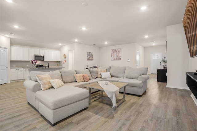 109 Egret Dr, Bastrop, TX 78602 - living area with recessed lighting, light wood-style floors, and baseboards