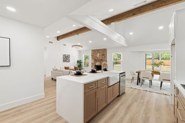 14806 Parco Path, Pflugerville, TX 78660 - kitchen with a sink, beamed ceiling, open floor plan, recessed lighting, and dishwasher