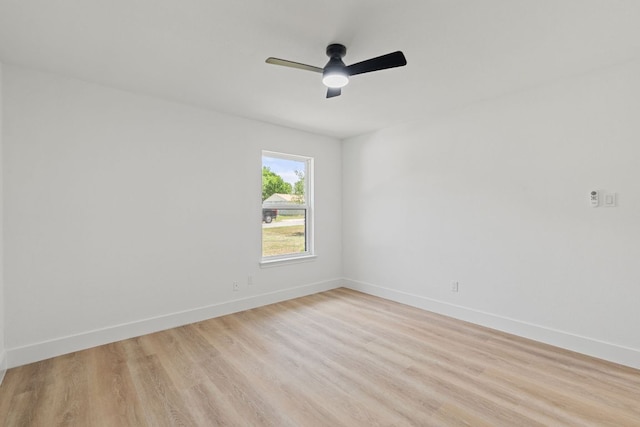 14806 Parco Path, Pflugerville, TX 78660 - spare room featuring light wood-style flooring, ceiling fan, and baseboards